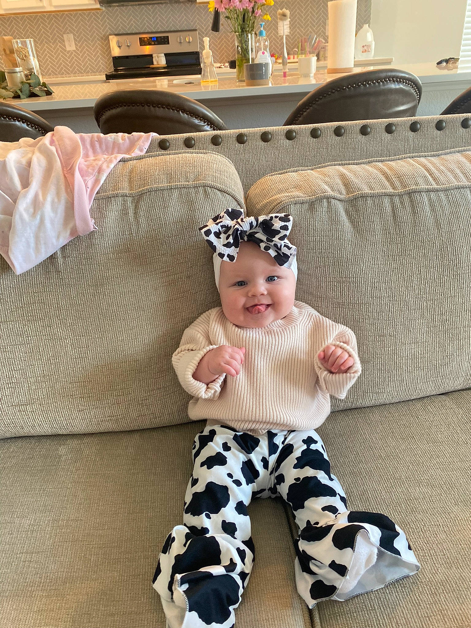 Tinslee is registered to the contest to win money with this photo: baby, baby_products, baby_toddler_clothing, child, costume, fashion_accessory, hair_accessory, happy, head, headpiece, headwear, human_leg, joy, leggings, pattern, person, room, sitting, sleeve, sock