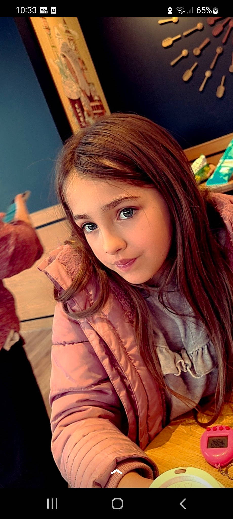 Mia is registered to the contest to win money with this photo: black_hair, child, cool, eye, eyebrow, eyelash, fun, gesture, happy, iris, layered_hair, lip, long_hair, mouth, neck, person, purple, shoulder, skin, smile