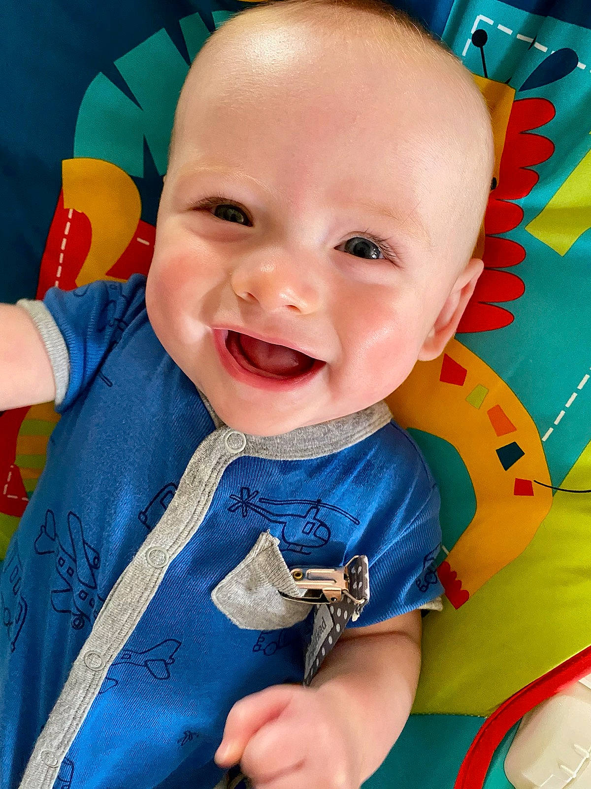 Auggie is registered to the contest to win money with this photo: azure, baby, baby_toddler_clothing, blue, cheek, chin, eyebrow, facial_expression, fun, gesture, hairstyle, happy, mouth, nose, person, pink, product, skin, sleeve, smile