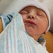 Harley is registered to the contest to win money with this photo: newborn, baby, sleeping, swaddled, blanket, hat, infant, closeup, resting, cozy, soft, peaceful, person, face, skin, human, child, portrait, indoors, sleep