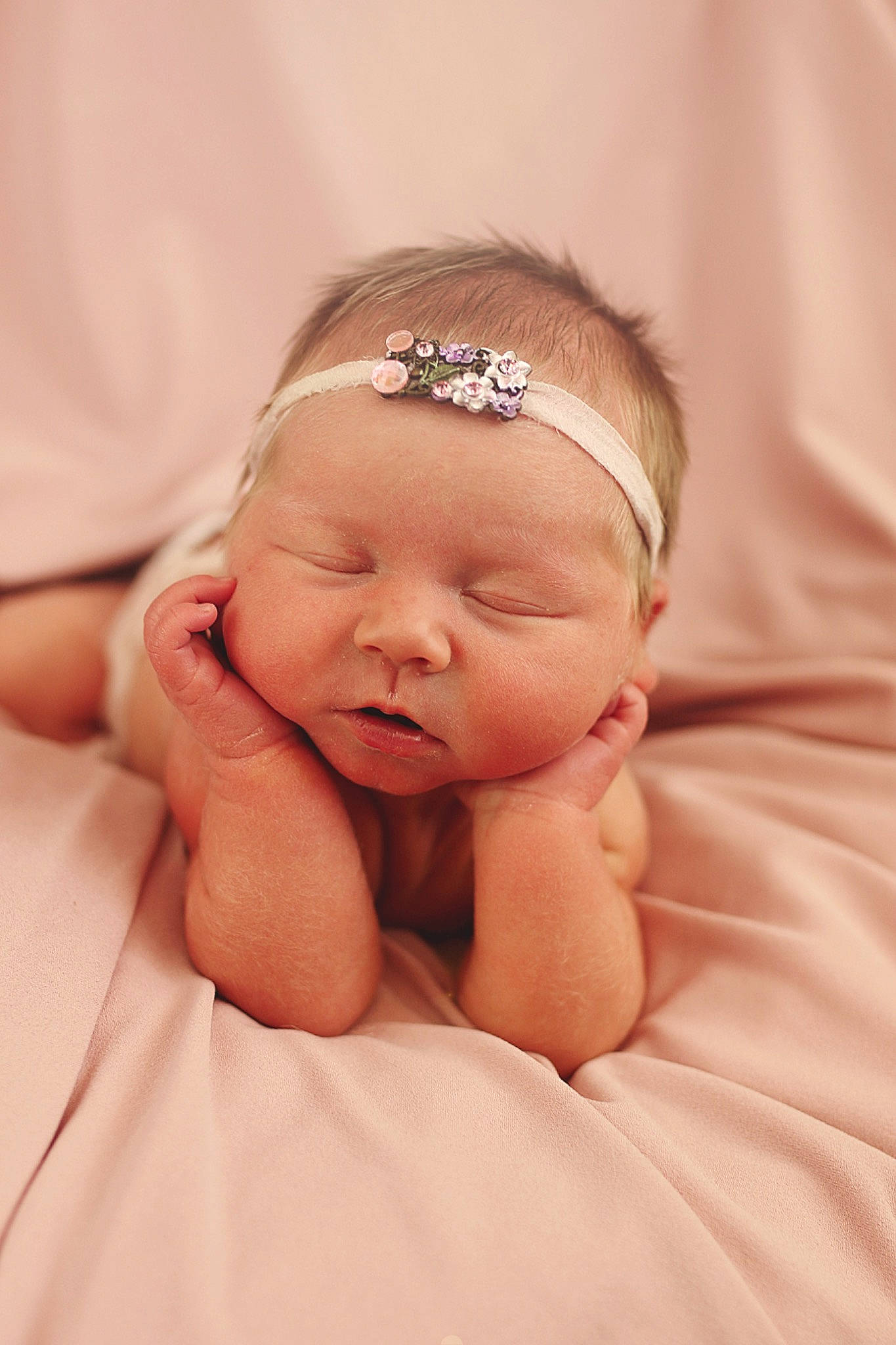 Emmy is registered to the contest to win money with this photo: arm, baby, cheek, chin, comfort, ear, eye, eyebrow, eyelash, face, finger, gesture, hand, headgear, human_body, iris, lip, neck, nose, person