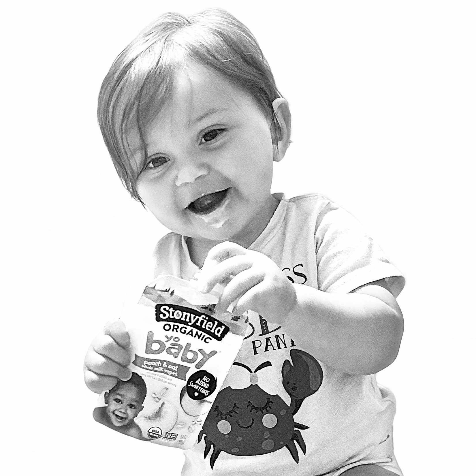 Raziella joined the competition — help win amazing prizes! baby, black_and_white, child, clothing, crab, cute, food, happy, holding, infant, messy_face, organic, person, portrait, smiling, snack, studio, toddler, tshirt, yogurt