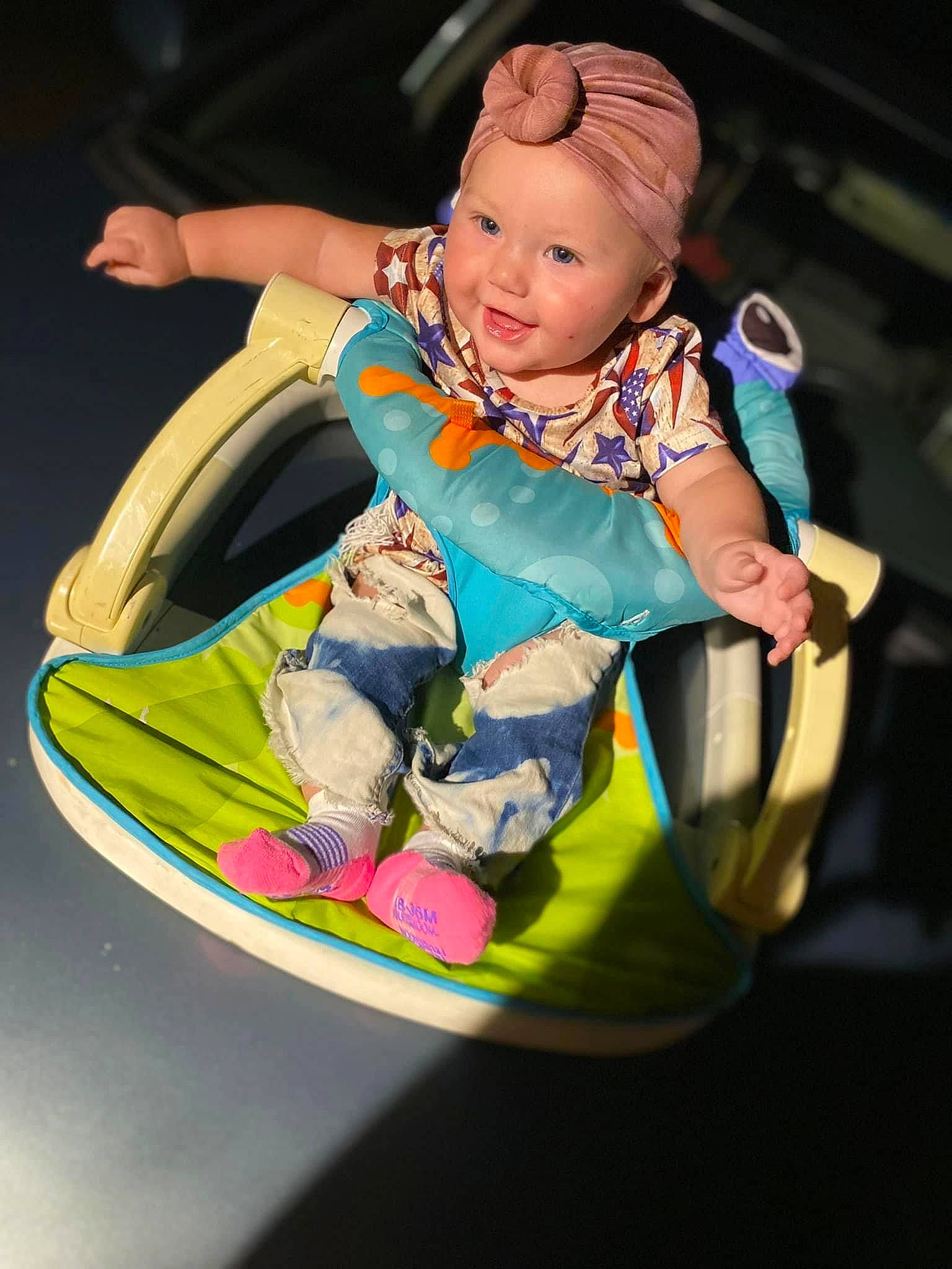 Sierra Mathews is registered to the contest to win money with this photo: baby, baby_carriage, baby_products, baby_toddler_clothing, baby_toys, bumper, child, circle, fun, happy, headwear, leisure, person, personal_protective_equipment, play, recreation, sitting, smile, toddler