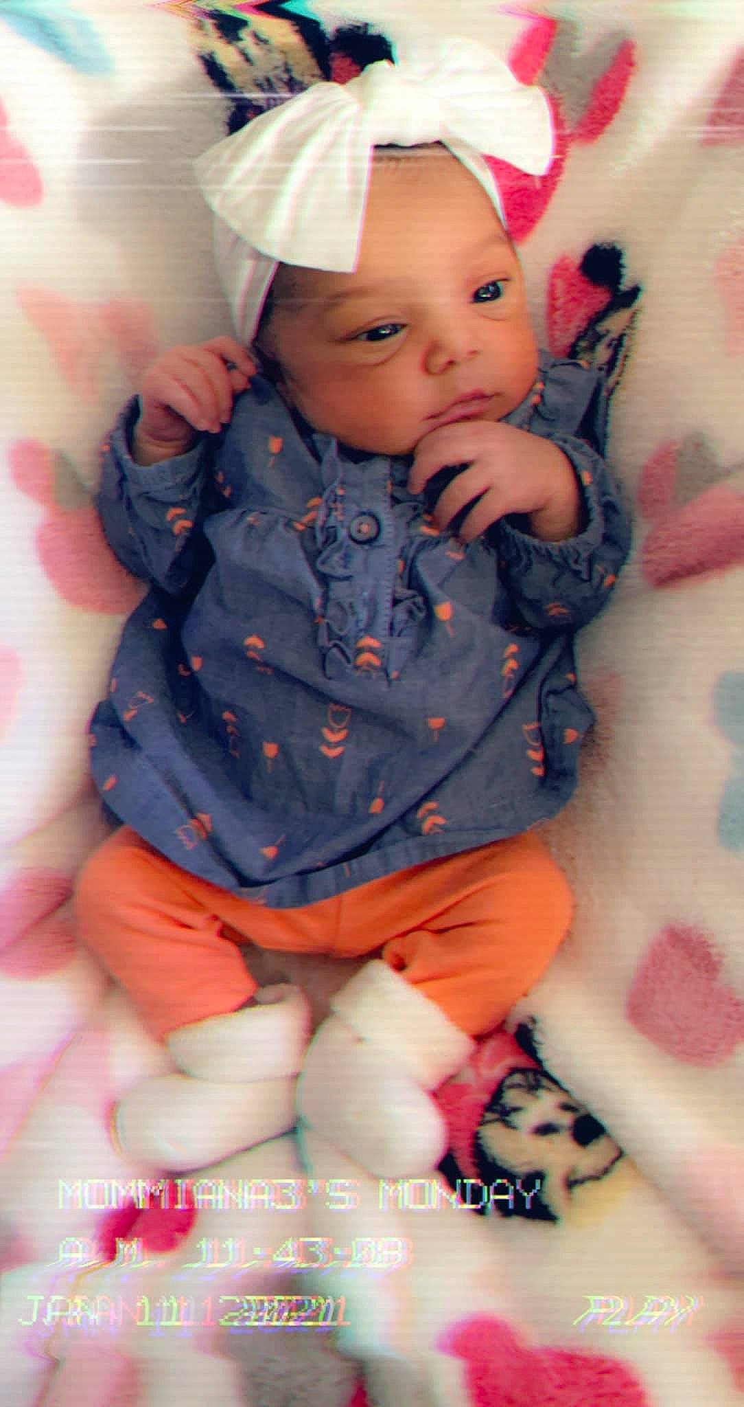 Meriah joined the competition — help win amazing prizes! arm, baby, baby_toddler_clothing, cheek, comfort, eye, happy, head, headwear, human_body, iris, lip, orange, person, pink, purple, skin, sleeve, sock, textile