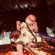 Rayla-Mae joined the competition — help win amazing prizes! baby, pacifier, blanket, couch, leather, baby_bottle, baby_wipes, infant, clothing, cute, person, lying_down, indoors, child, comfort, soft, resting, face, small, wearing