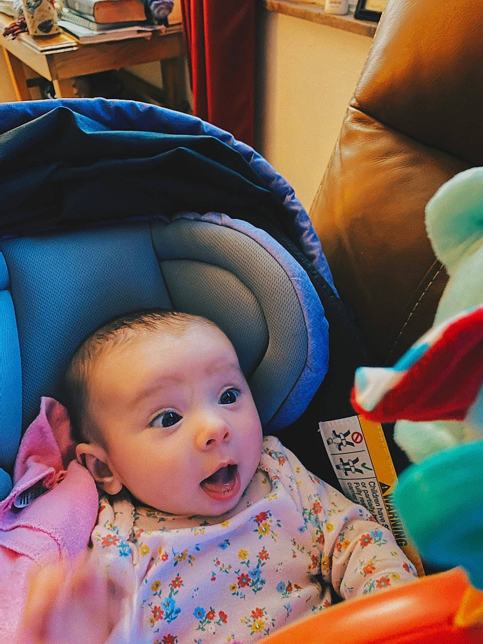 Elianna is registered to the contest to win money with this photo: baby, baby_products, baby_toddler_clothing, blue, car_seat, chair, cheek, child, comfort, facial_expression, fun, hairstyle, human, mouth, nose, person, photograph, sitting, skin, snapshot