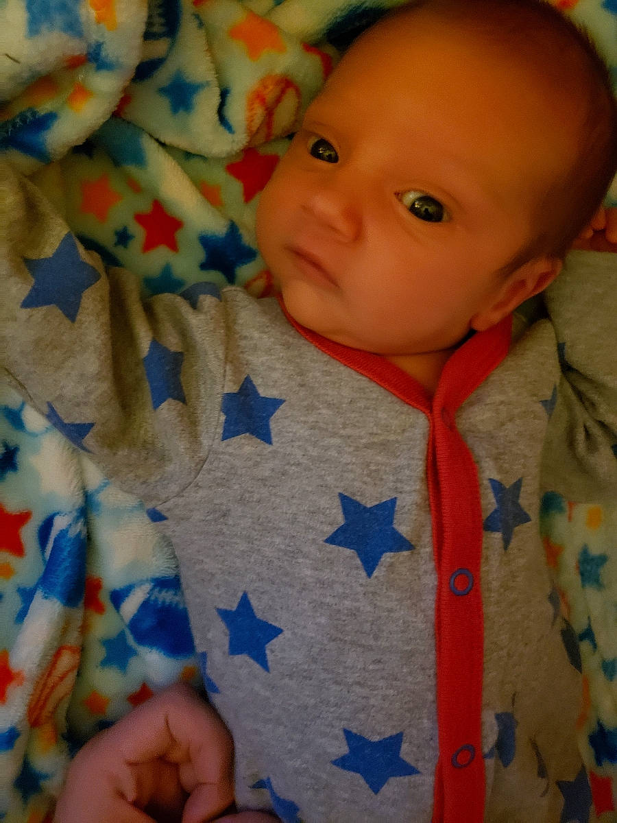 Axton joined the competition — help win amazing prizes! baby, bedtime, blanket, blue, cheek, child, eye, face, head, lip, mouth, nose, person, skin, smile, textile, toddler