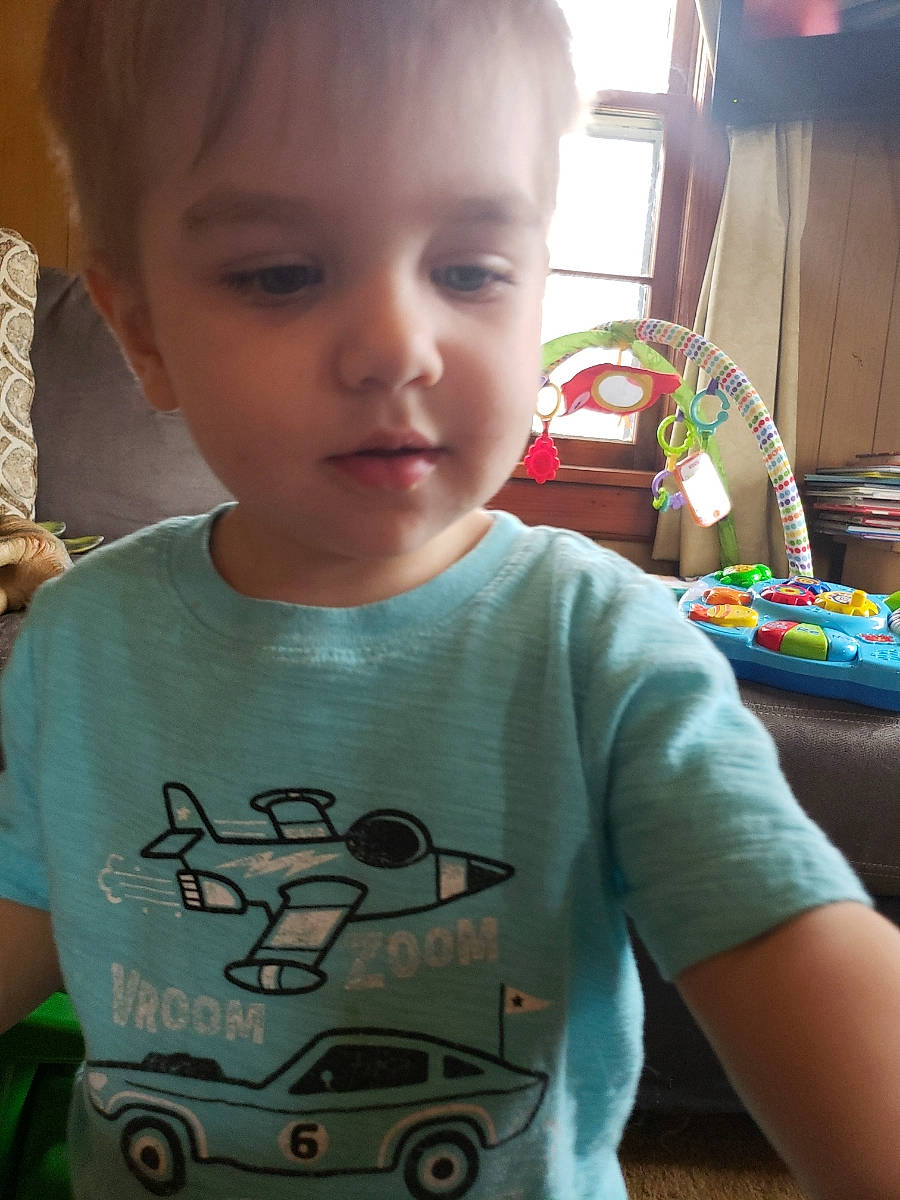 Ryker is registered to the contest to win money with this photo: baby, cheek, child, cool, fun, head, neck, nose, person, play, product, skin, sleeve, smile, t_shirt, toddler, top, toy