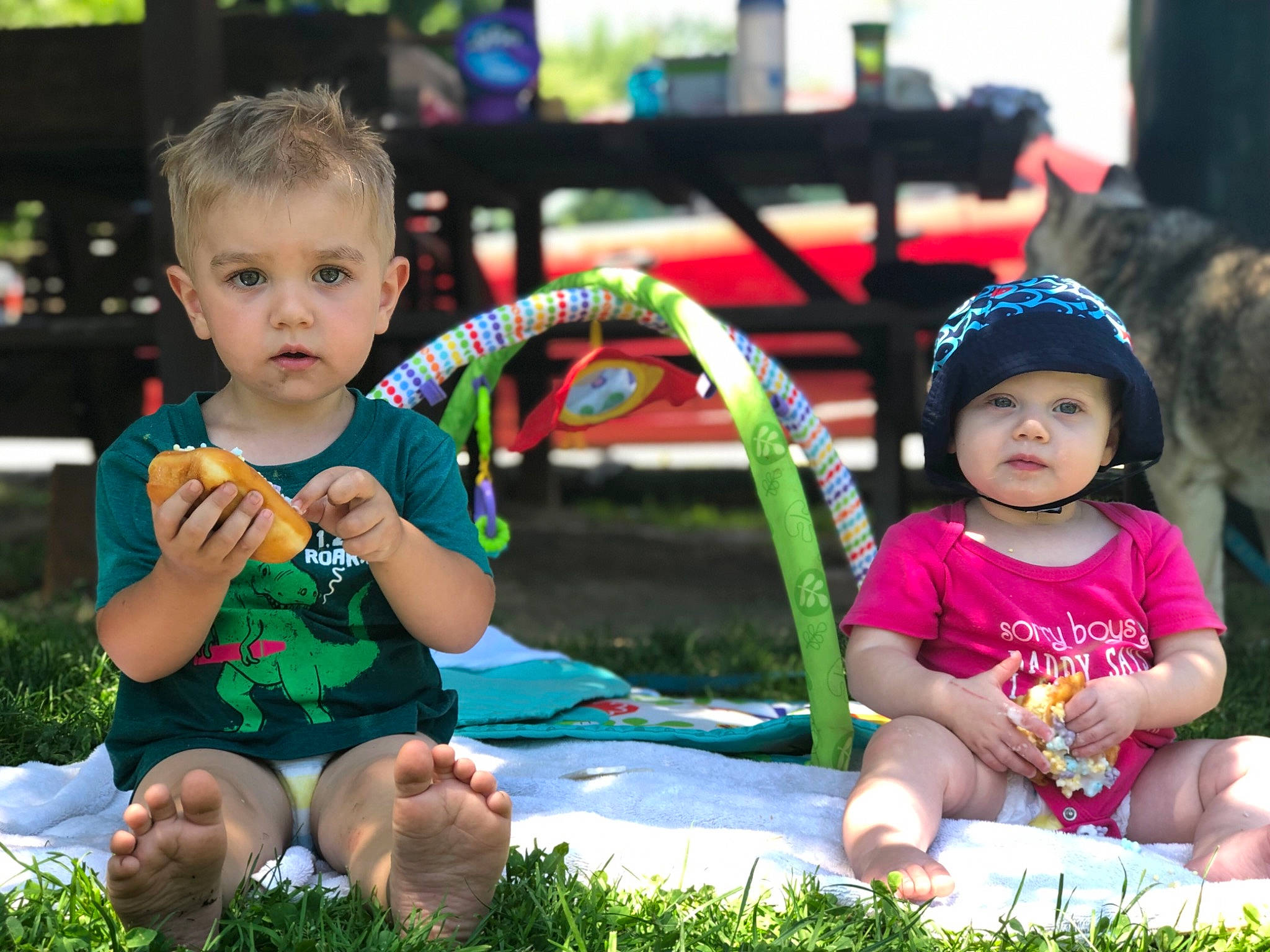Ryker is registered to the contest to win money with this photo: baby, child, face, fun, grass, happy, leisure, people, person, play, recreation, sibling, sitting, skin, smile, summer, toddler, toy, vacation