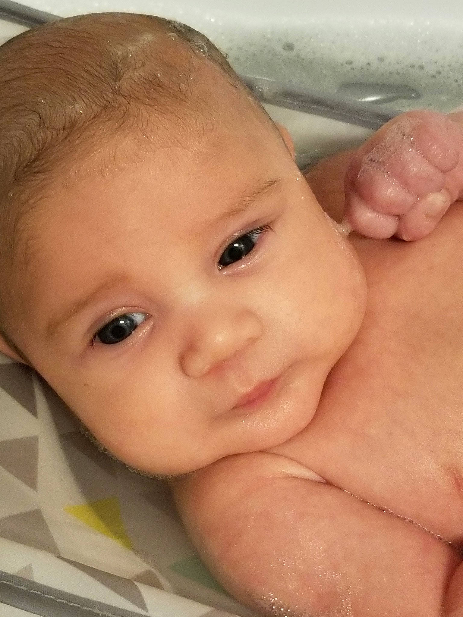 Luis joined the competition — help win amazing prizes! baby, baby_bathing, bathing, cheek, child, chin, close_up, eye, eyebrow, face, finger, forehead, hand, head, lip, mouth, muscle, nose, person, skin