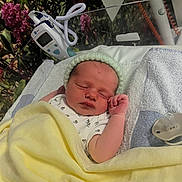 Grayson is registered to the contest to win money with this photo: newborn, baby, sleeping, blanket, hospital, bassinet, hat, medical_equipment, pacifier, towel, infant, cute, resting, child, soft, cozy, indoors, person, portrait, nursery