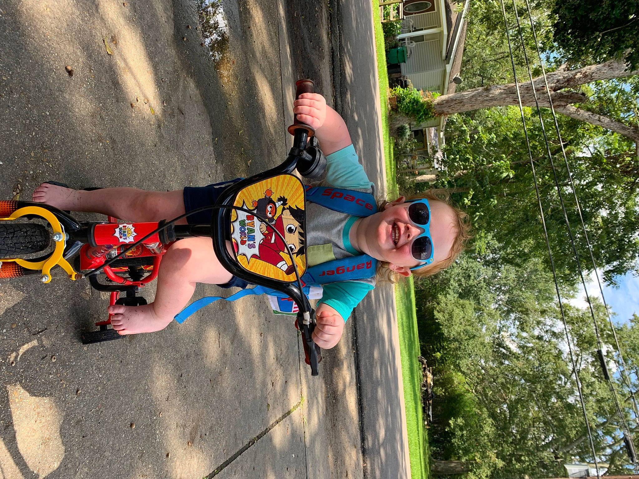 Cooper joined the competition — help win amazing prizes! adventure, child, climbing_harness, cool, elbow, fun, happy, knee, leisure, person, plant, recreation, rope, sandal, shorts, sport_climbing, sunglasses, t_shirt, thigh, tree