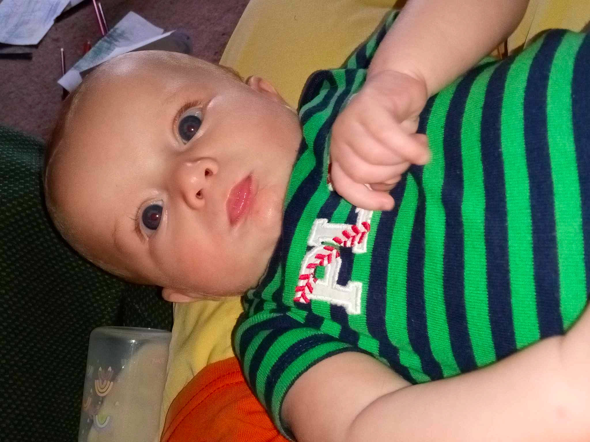 Cliffard is registered to the contest to win money with this photo: baby, baby_toddler_clothing, cheek, chest, elbow, eyelash, finger, gesture, hand, happy, human_body, lip, mouth, nail, neck, nose, person, sleeve, thumb, toddler