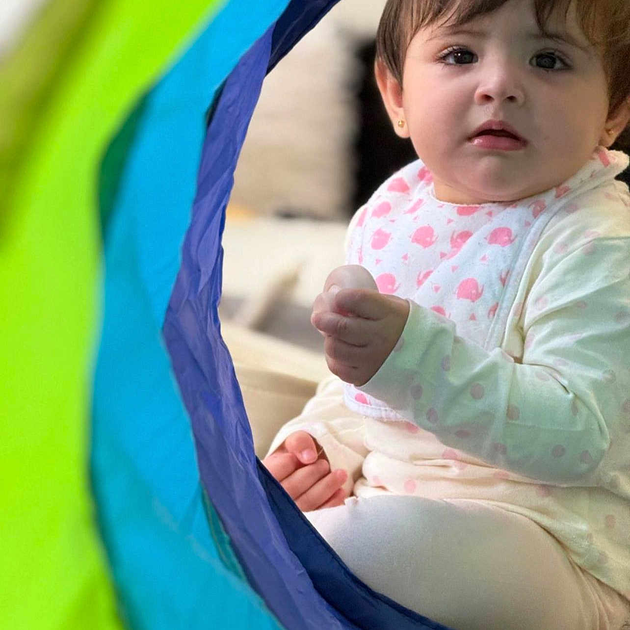 Mahwa joined the competition — help win amazing prizes! baby, child, clothing, colorful, cozy, curious, cute, expression, face, hand, head, indoor, infant, person, pink, play_tunnel, sitting, soft_lighting, toy, white