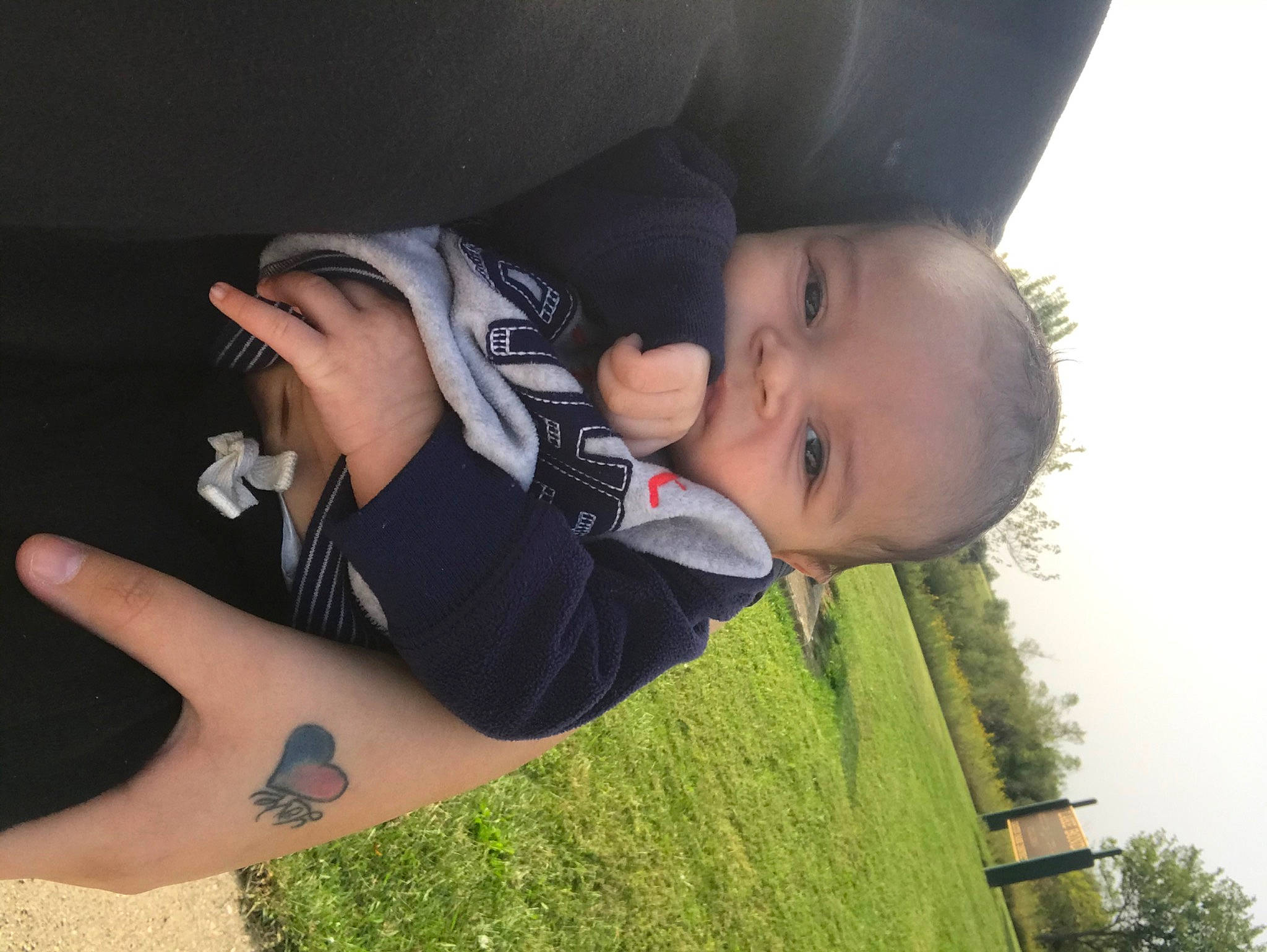 Ezeriah is registered to the contest to win money with this photo: arm, baby, black_hair, cheek, child, cool, eye, grass, hand, happy, head, headgear, leg, mouth, nose, person, photography, plant, skin, smile