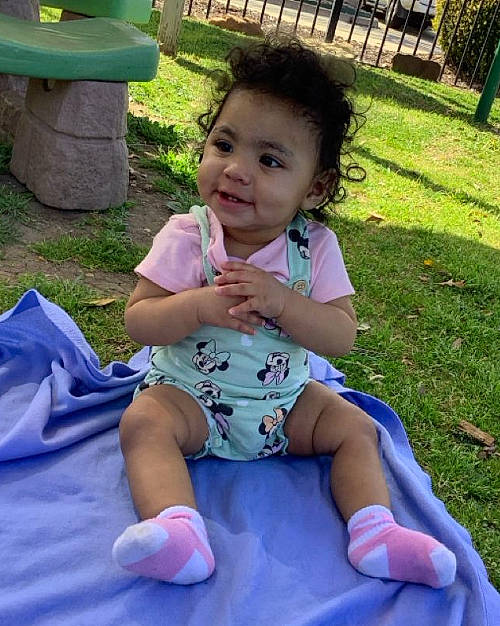 Abrielle is registered to the contest to win money with this photo: baby_toddler_clothing, face, fun, grass, green, hair, happy, head, joy, leg, leisure, mouth, person, pink, purple, recreation, shorts, skin, smile, summer