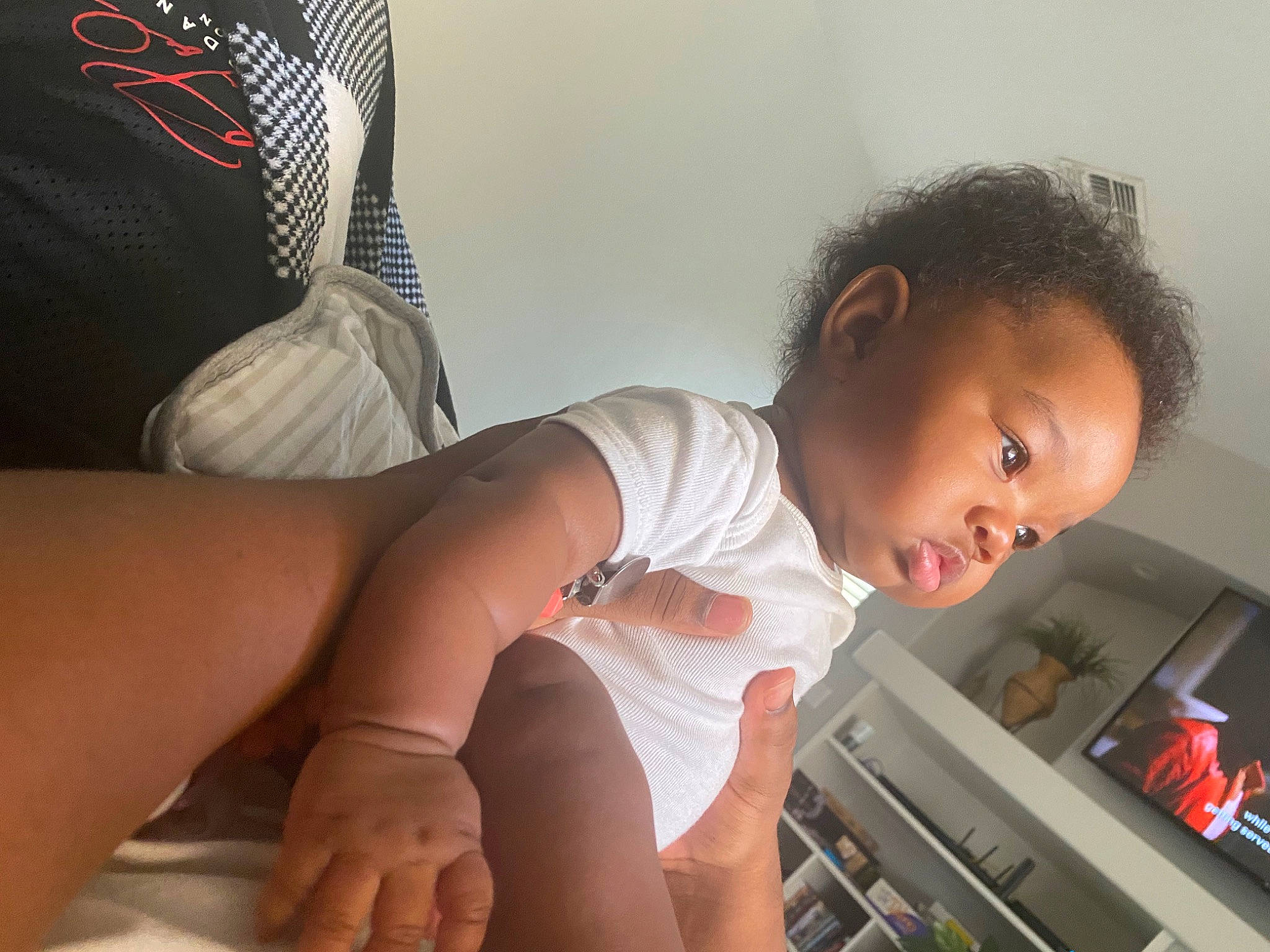 Amora is registered to the contest to win money with this photo: arm, baby, black_hair, comfort, dress, elbow, finger, flash_photography, hand, joint, knee, leg, mouth, muscle, neck, person, shorts, skin, stomach, thigh