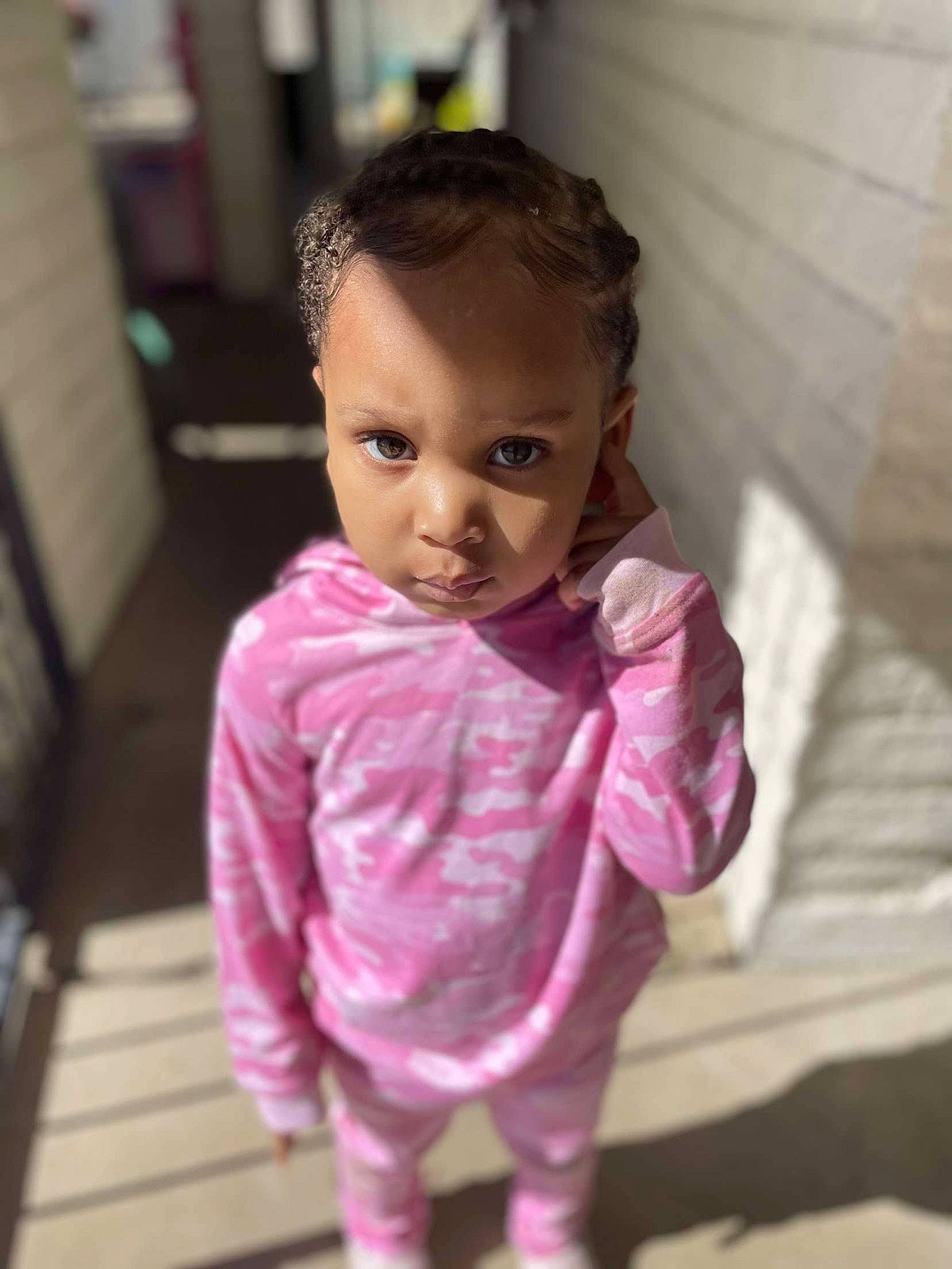 Queen is registered to the contest to win money with this photo: baby, baby_toddler_clothing, brown_hair, cheek, child, dress_shirt, eye, eyelash, foot, happy, iris, lip, long_hair, magenta, nose, person, pink, purple, sleeve, toddler