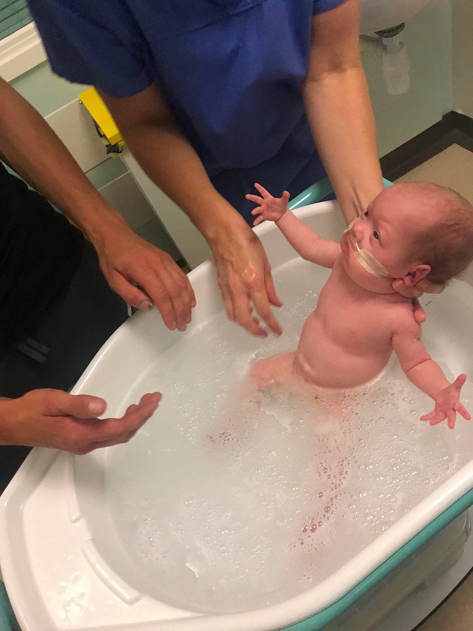 Ella Mae is registered to the contest to win money with this photo: baby_bathing, bathing, bathtub, child, hand, person, washing