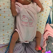 Ella Mae is registered to the contest to win money with this photo: baby, baby_products, baby_toddler_clothing, child, pattern, photo_caption, play, product, sleeve, toddler