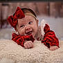 baby, infant, smiling, red_bow, red_clothing, headband, blanket, soft_texture, happy, cute, portrait, indoor, face, cheerful, holiday, christmas, cozy, child, young, toddler