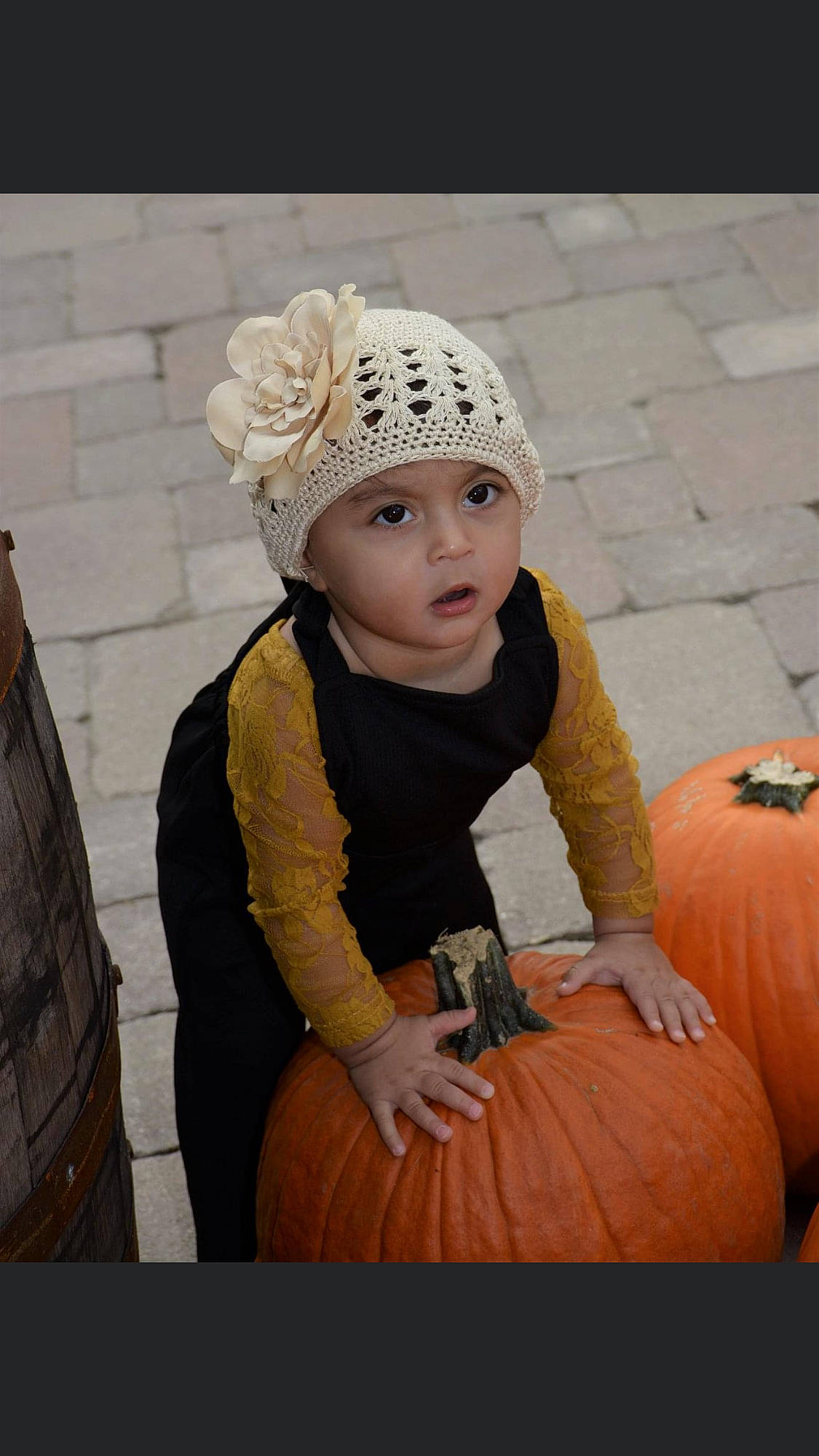 Unity is registered to the contest to win money with this photo: baby, beanie, calabaza, cap, child, clothing, cucurbita, headgear, headwear, knit_cap, person, plant, pumpkin, toddler, winter_squash