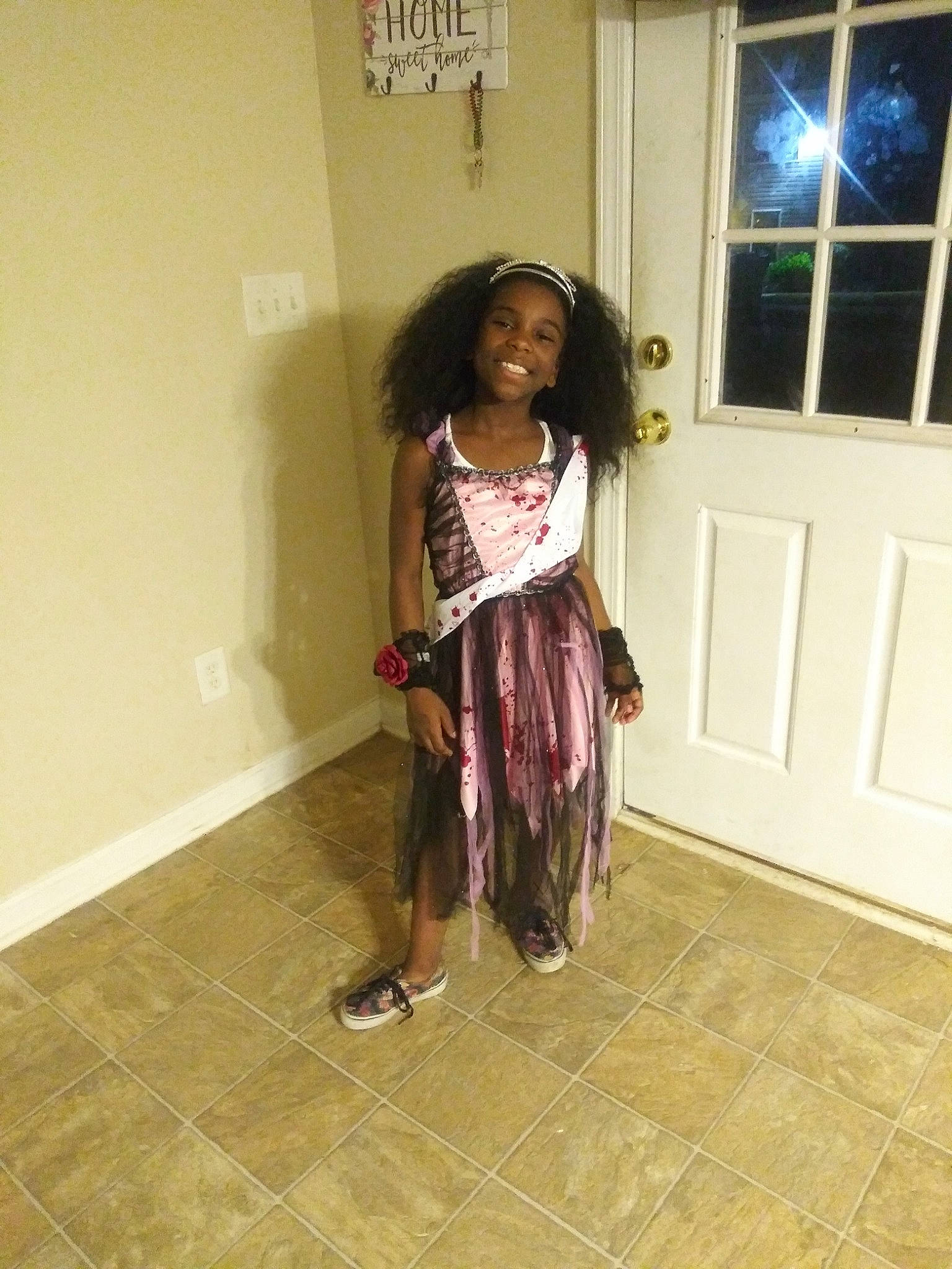 Zaria is registered to the contest to win money with this photo: child, day, floor, flooring, fun, girl, hair, hairstyle, joy, long_hair, pattern, person, product, shoe, shoulder, snapshot, standing, trunk