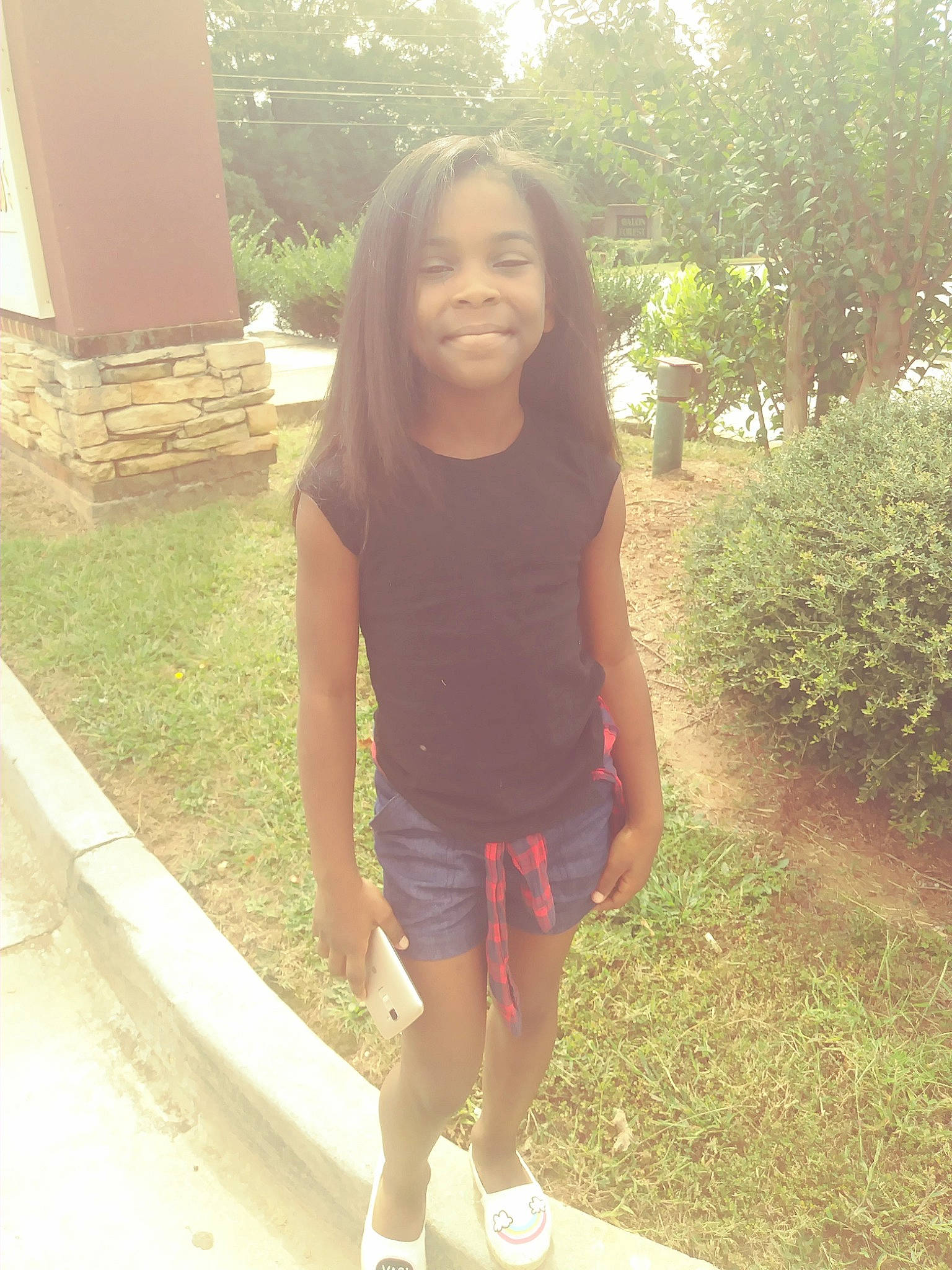 Zaria is registered to the contest to win money with this photo: black_hair, child, clothing, cool, day, fun, girl, grass, happiness, joy, leg, long_hair, person, pink, shorts, shoulder, smile, snapshot, standing, summer