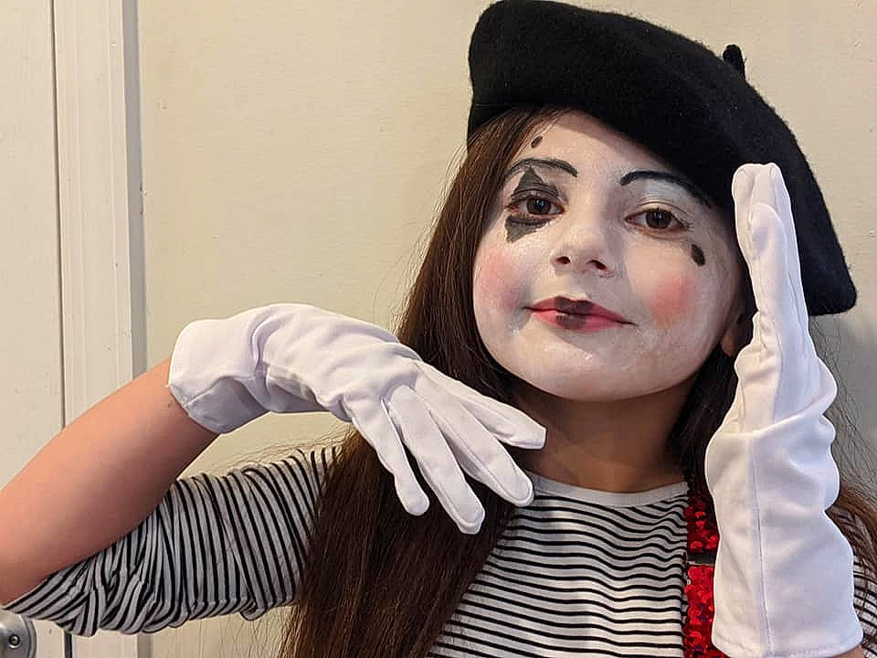 Lily is registered to the contest to win money with this photo: bracelet, costume, costume_accessory, costume_hat, headgear, mime_artist, no_expression, person, portrait, wrist