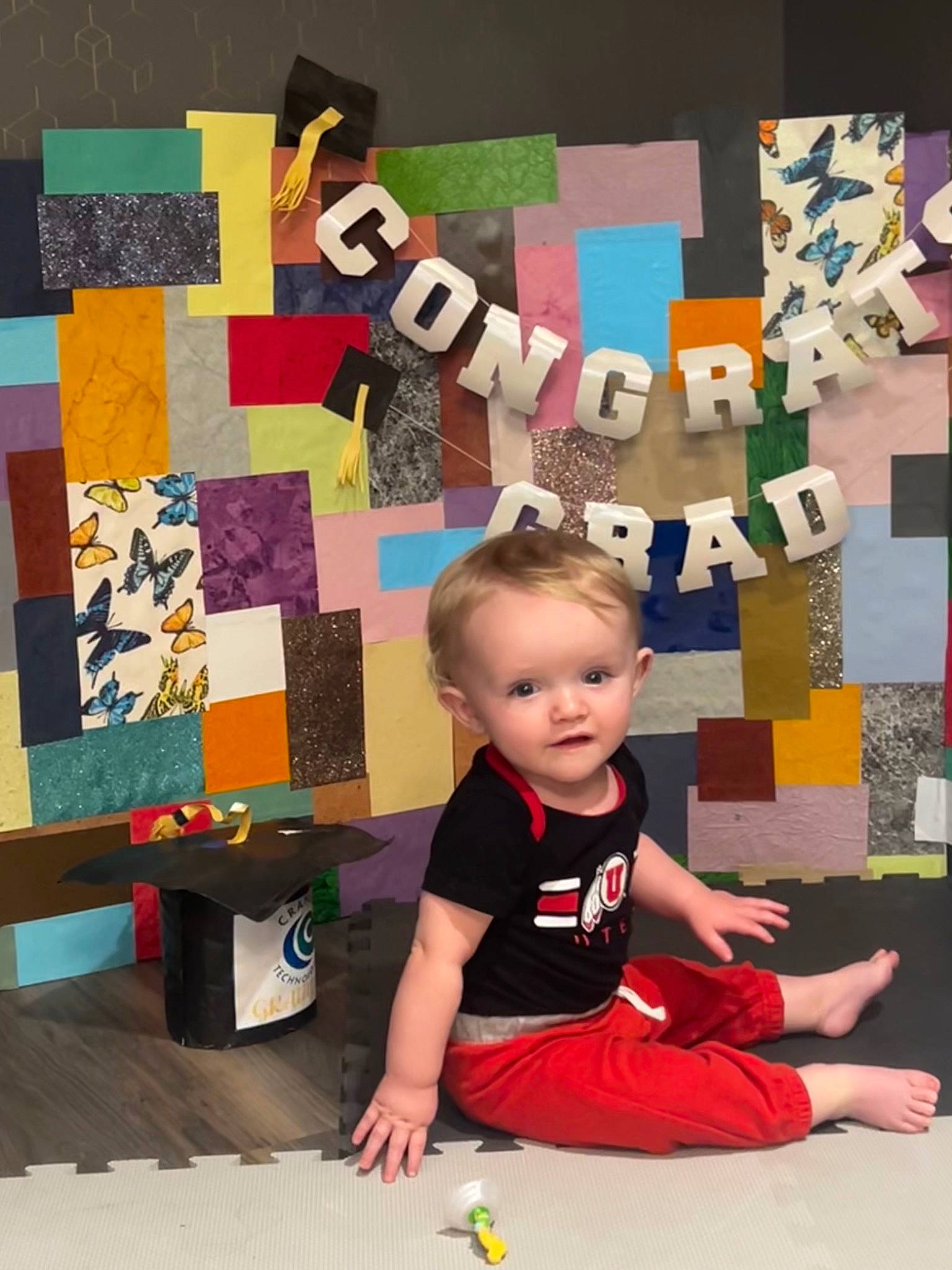 Thomas is registered to the contest to win money with this photo: art, baby, baby_toddler_clothing, child, craft, creative_arts, flooring, fun, linens, pattern, person, play, rectangle, room, sitting, t_shirt, toddler, visual_arts, wood, world