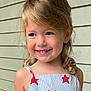child, smiling, blonde_hair, curly_hair, dress, stars, striped, portrait, happy, face, shoulder, outdoor, person, young, cute, skin, head, eyebrows, eyes, background