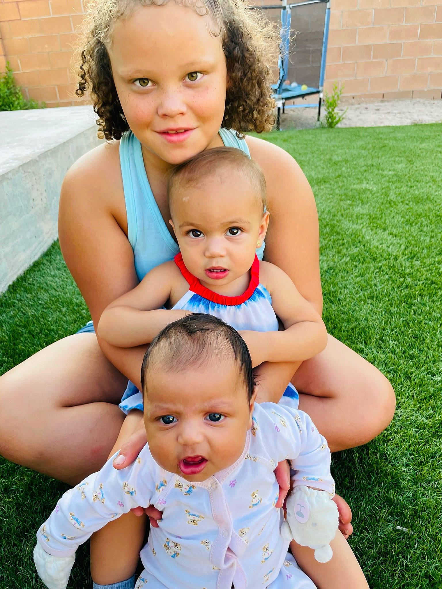 Jazmine joined the competition — help win amazing prizes! arm, baby, baby_toddler_clothing, blue, clothing, eye, face, finger, gesture, grass, green, hand, happy, head, joy, people_in_nature, person, photograph, plant, skin