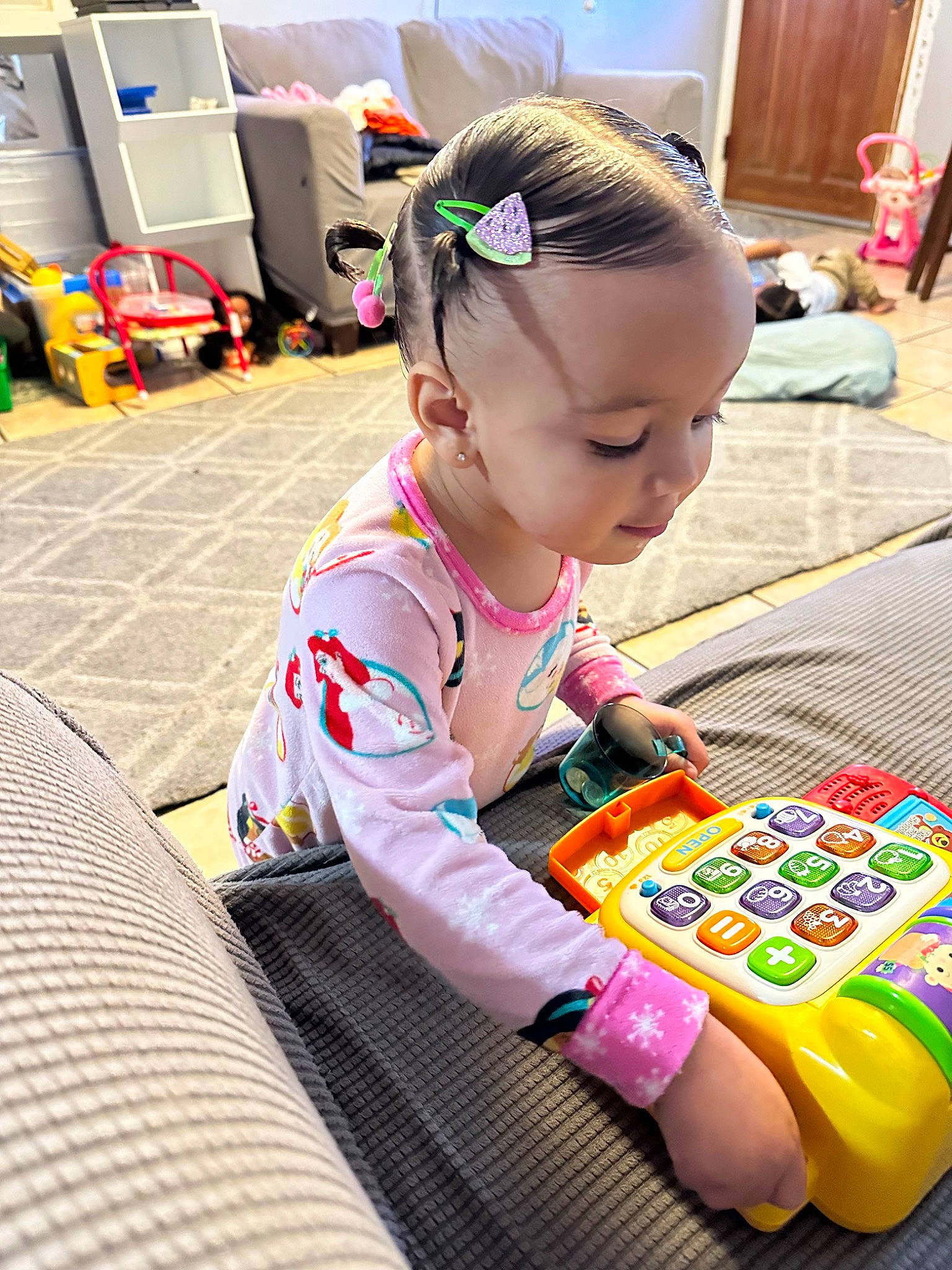 Thalia Arielle joined the competition — help win amazing prizes! audio_equipment, baby, baby_playing_with_toys, baby_toddler_clothing, cabinetry, child, flooring, fun, gadget, hair_tie, happy, learning, person, play, room, sitting, technology, toddler, toy