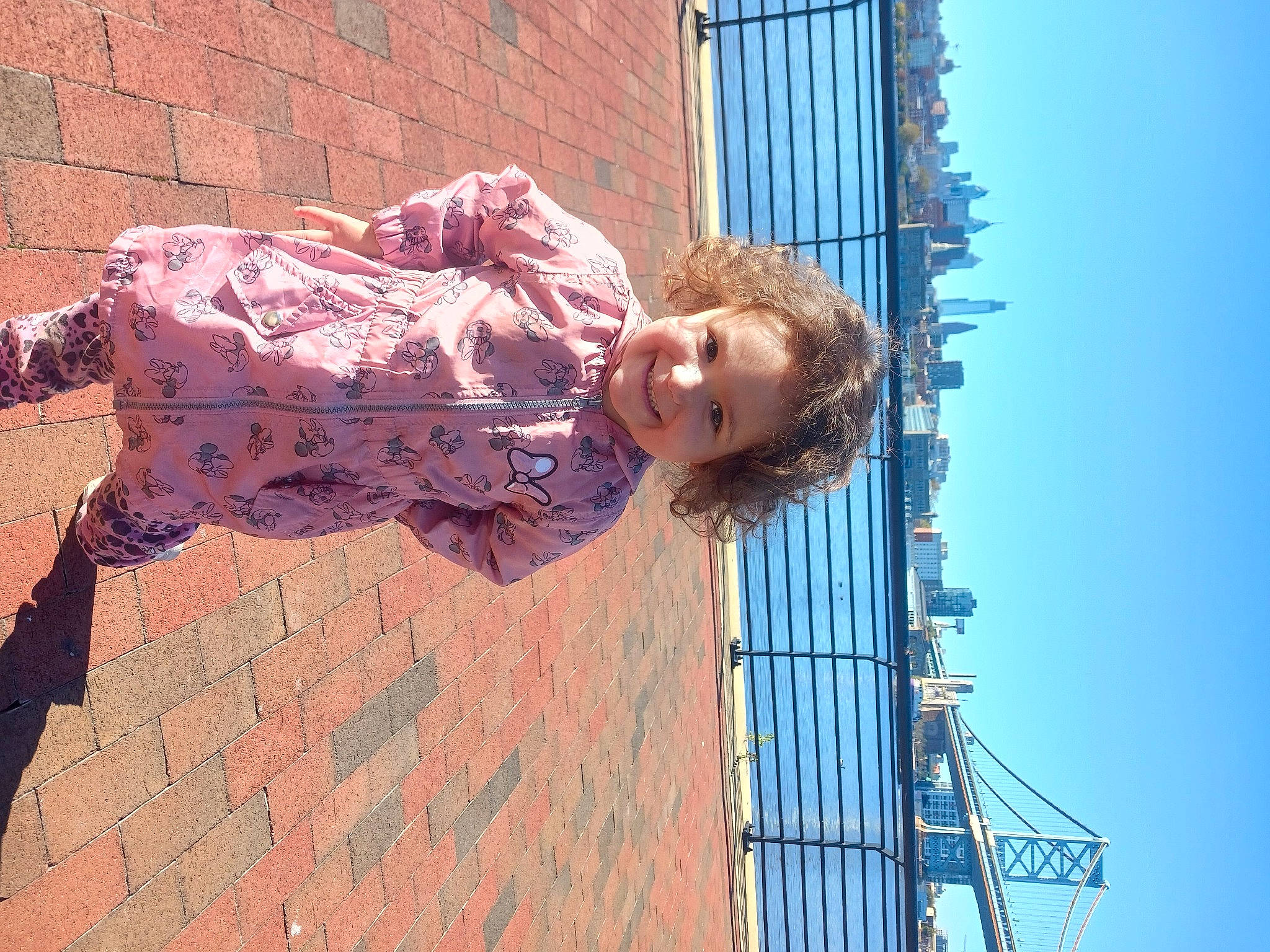 Isabella joined the competition — help win amazing prizes! blue, brick, brickwork, child, concrete, electric_blue, facade, fun, happy, joy, leisure, magenta, pattern, person, sky, smile, visual_arts, window