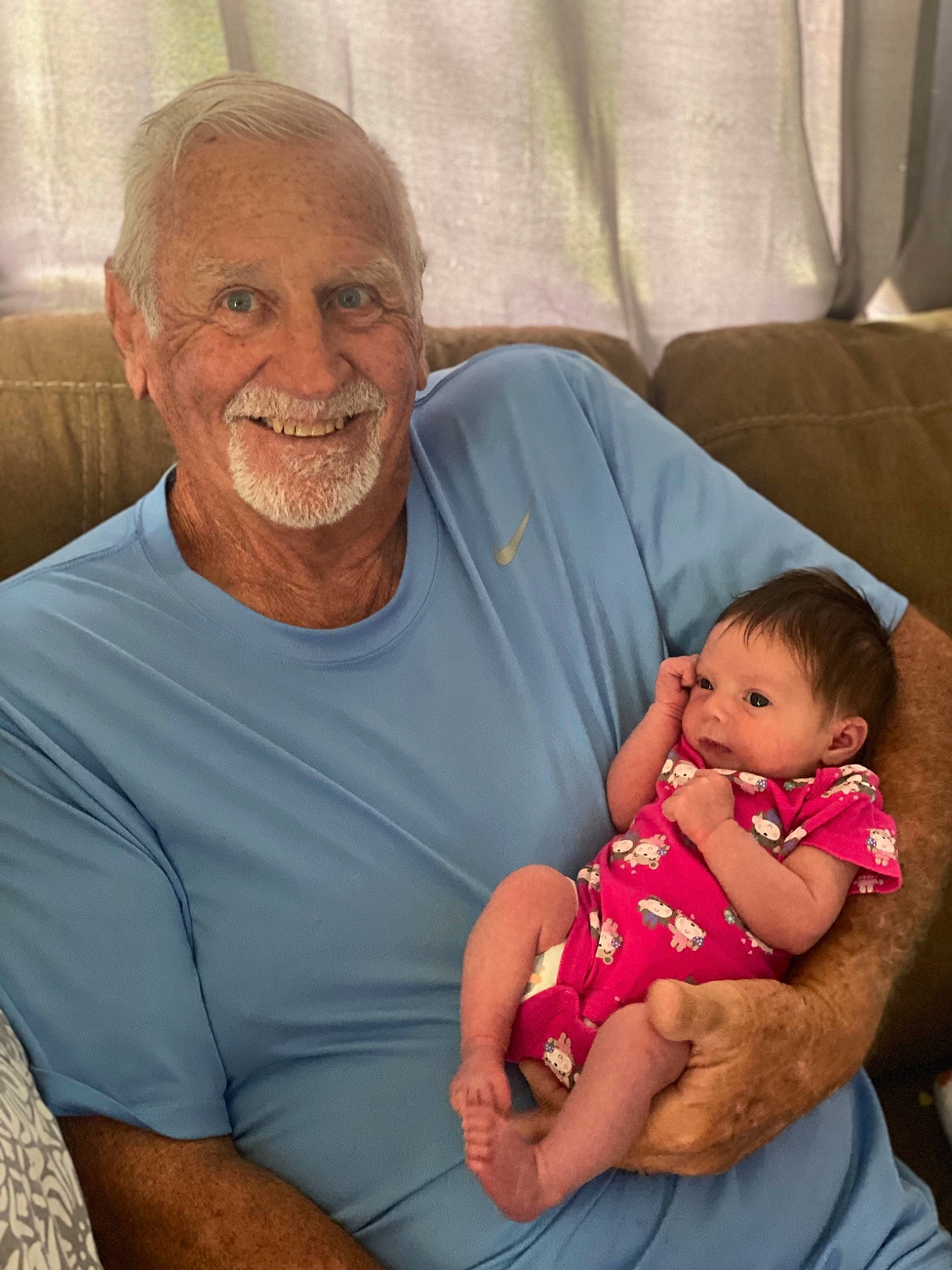 Anaya is registered to the contest to win money with this photo: abdomen, baby, baby_toddler_clothing, cheek, child, comfort, couch, event, facial_expression, hairstyle, happy, iris, joy, lap, mouth, person, sitting, skin, smile, t_shirt