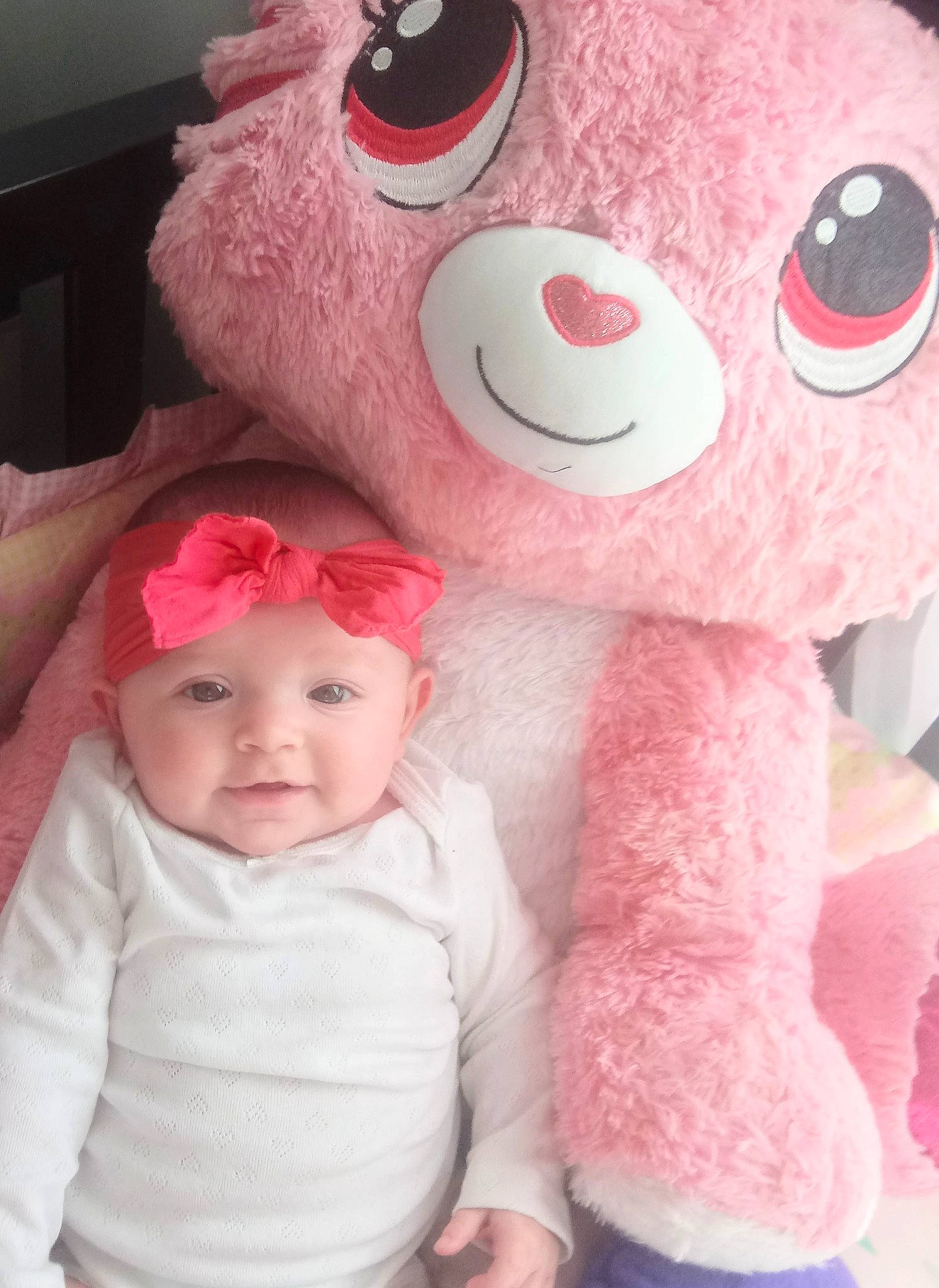 Amanda joined the competition — help win amazing prizes! baby, baby_toddler_clothing, cheek, child, facial_expression, happy, head, headgear, headwear, mouth, nose, organ, person, pink, skin, sleeve, smile, stuffed_toy, textile, toddler