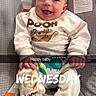 Zarin is registered to the contest to win money with this photo: baby, smiling, pooh, clothing, infant, child, seat, happy, indoors, colorful, animal_print, baby_seat, portrait, cute, sitting, apparel, text_overlay, social_media, playful, young_child