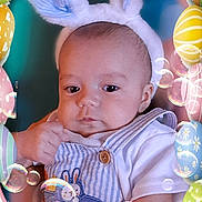 Zarin is registered to the contest to win money with this photo: baby, bunny_ears, easter_eggs, bubbles, blue_overalls, striped_clothing, infant, portrait, cute, child, celebration, holiday, spring, colorful, festive, headwear, hand, soft_toy, smiling, fun