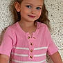 child, girl, smile, portrait, blue_eyes, pink_dress, striped_clothing, long_hair, buttoned_top, indoor, wall_background, happy, cute, fashion, person, young_child, casual, standing, closeup, human