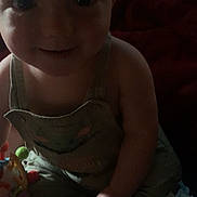 Jaxzon joined the competition — help win amazing prizes! baby, baby_yoda, blanket, child, close_up, clothing, cute, diaper, dim_lighting, fabric, face, hand, indoor, infant, overalls, person, playtime, smiling, toddler, toy