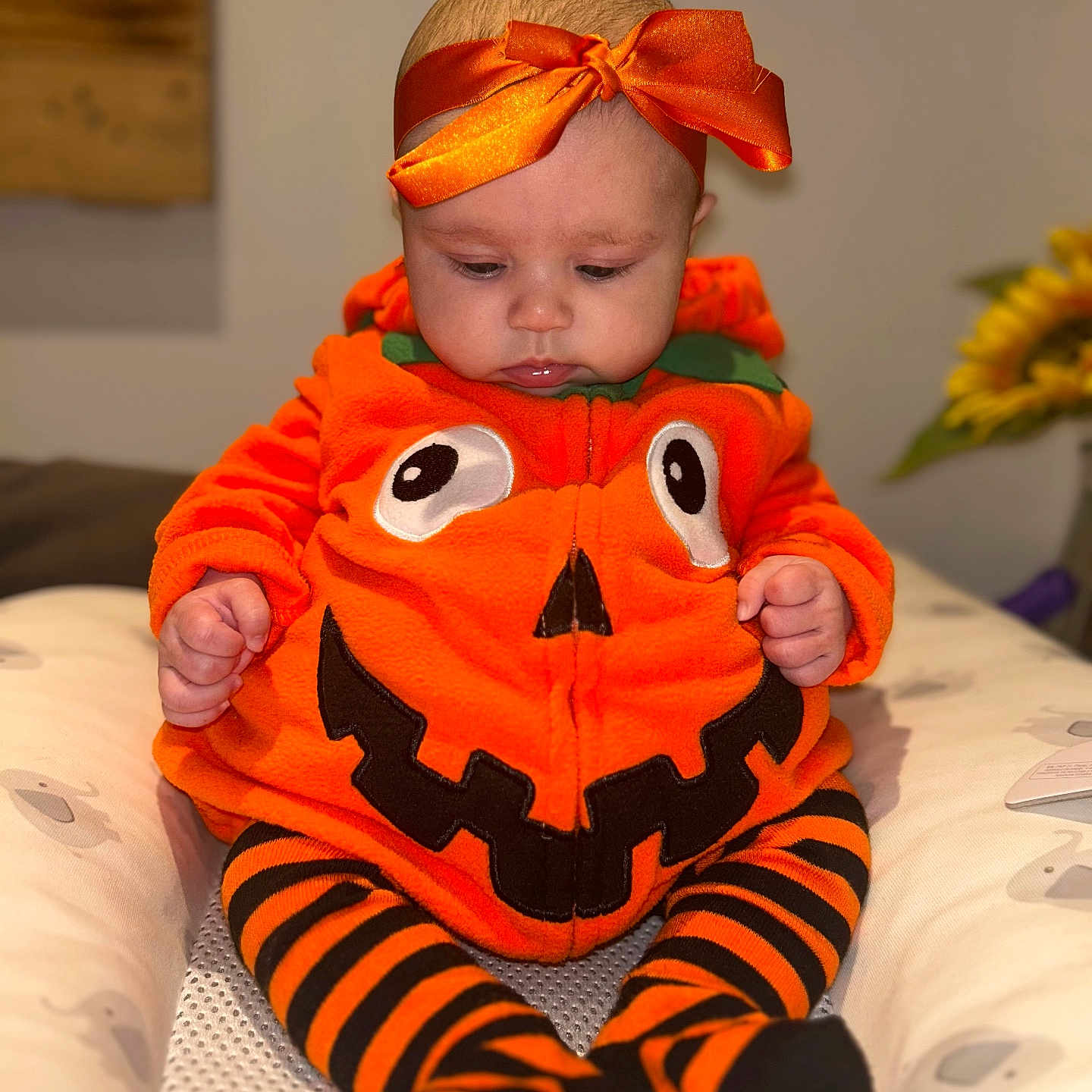 Poppy joined the competition — help win amazing prizes! baby, child, clothing, costume, cozy, cute, decor, expression, face, halloween, headband, holiday, indoor, infant, orange, portrait, pumpkin, sitting, soft_lighting, striped_leggings