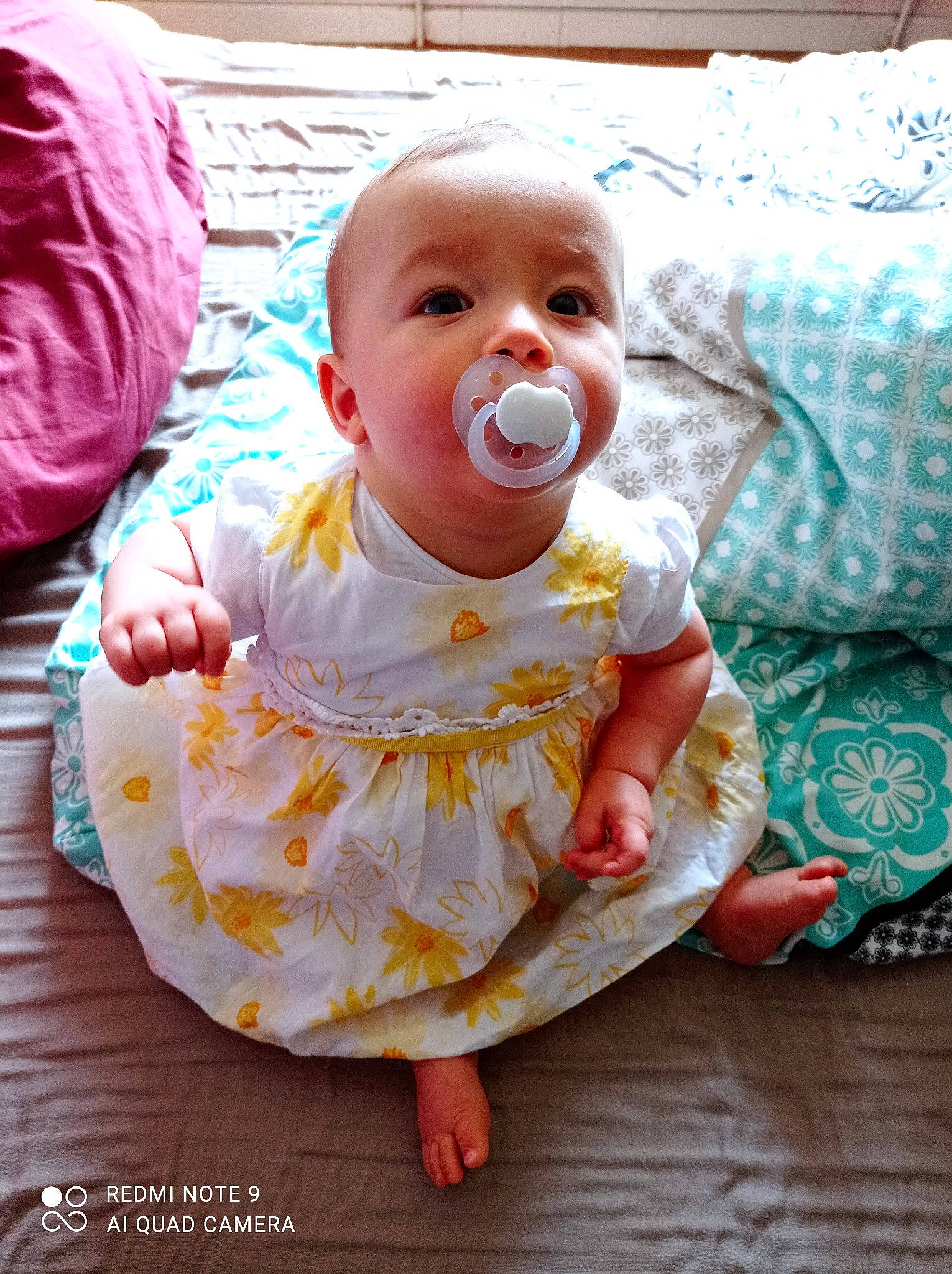 Sinaÿ participe au concours pour gagner de l'argent avec cette photo : baby, baby_toddler_clothing, cheek, child, comfort, eye, face, fun, hairstyle, happy, iris, linens, lip, mouth, nose, orange, person, pink, skin, sleeve