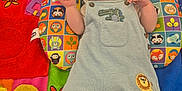 Denni is registered to the contest to win money with this photo: baby, sleeping, pacifier, overalls, animal_patch, colorful_quilt, pillow, patterned_pillow, child, infant, cute, resting, soft_toys, playmat, indoor, footwear, sock, hand, face, peaceful
