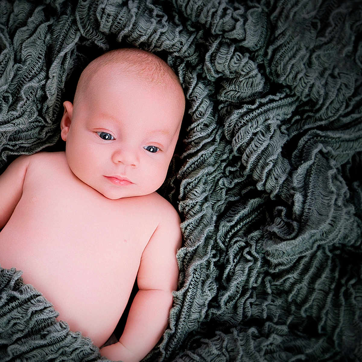 Denni is registered to the contest to win money with this photo: baby, blanket, child, closeup, cozy, cute, expression, eyes, face, indoors, infant, lying_down, naked_torso, newborn, peaceful, portrait, skin, soft, texture, wrapped