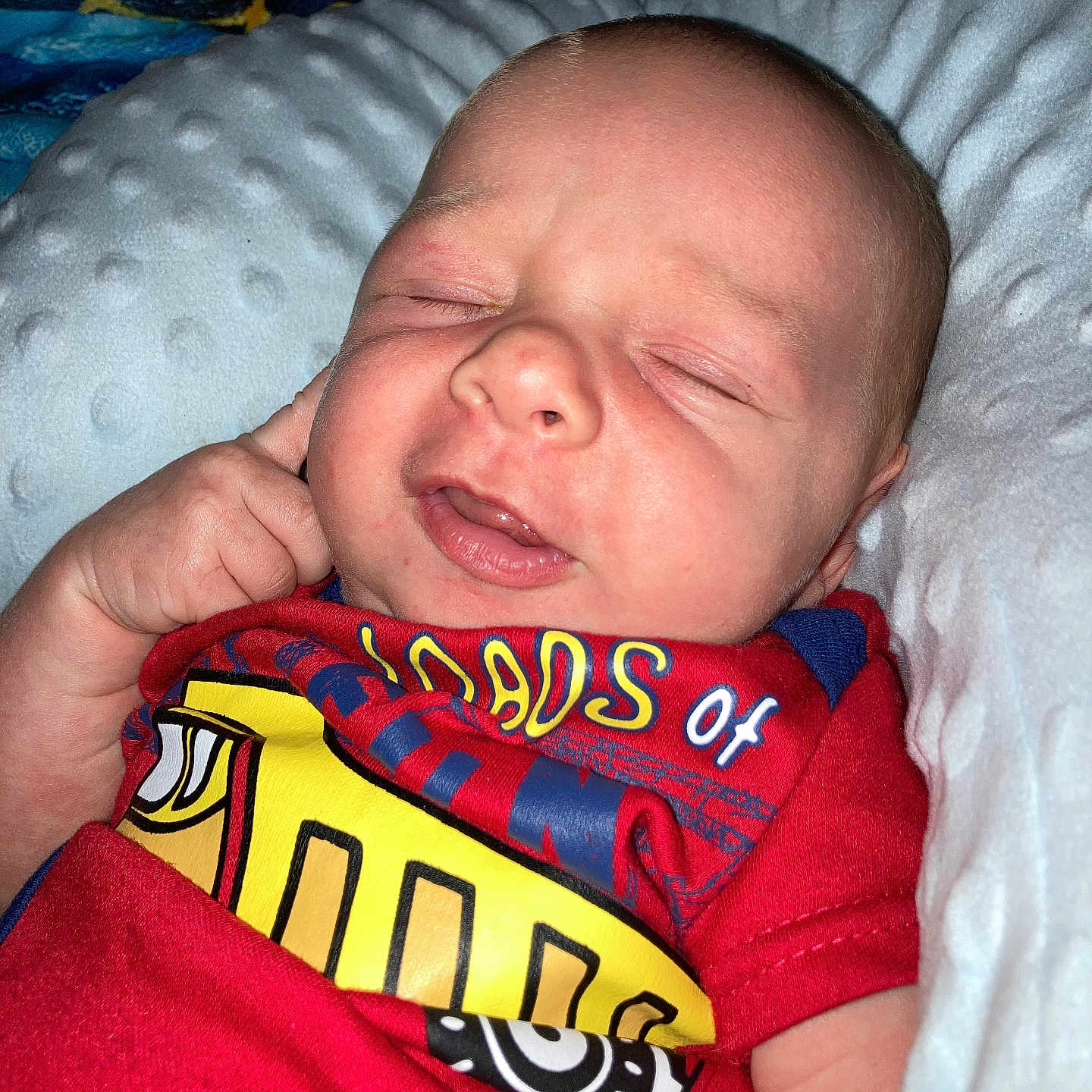 Kozmoe joined the competition — help win amazing prizes! baby, blanket, blue_shirt, child, clothing, cute, eyes_closed, face, hand, indoors, infant, newborn, pillow, portrait, red_shirt, resting, skin, sleepy, smile, young