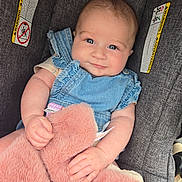 Sophia joined the competition — help win amazing prizes! baby, infant, child, denim, blue_eyes, car_seat, blanket, pink, soft, cute, clothing, person, seat, child_seat, holding, smiling, face, skin, arm, hand
