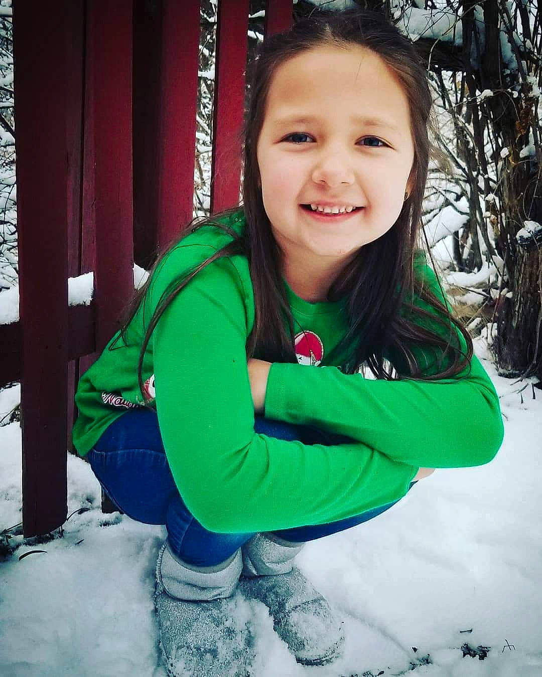 Aaylah joined the competition — help win amazing prizes! child, cool, face, fun, green, happy, head, joy, outerwear, person, play, skin, smile, snow, toddler, tree, winter