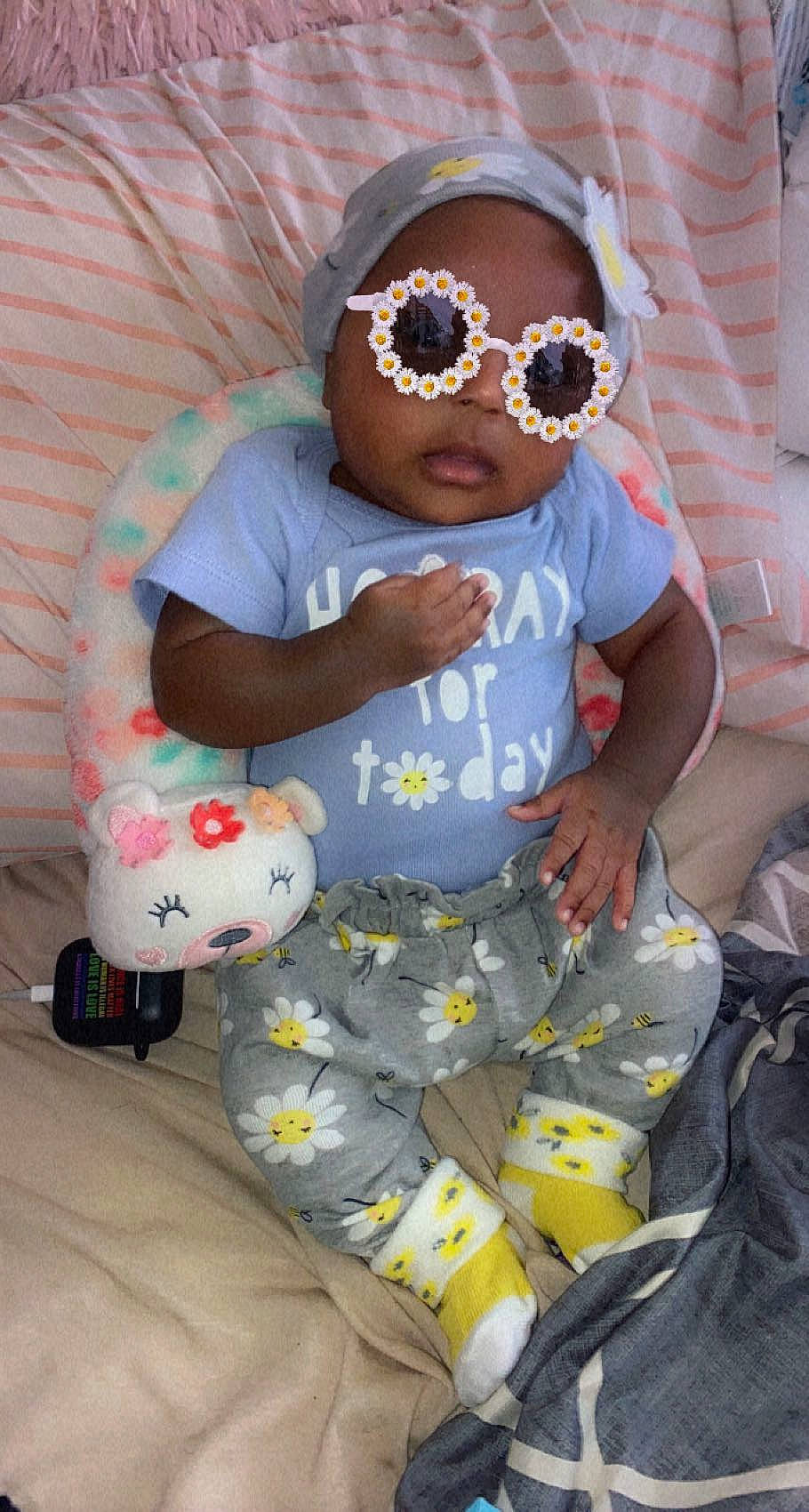 Kali joined the competition — help win amazing prizes! baby, baby_products, baby_toddler_clothing, child, comfort, eyewear, fun, goggles, head, headwear, pattern, person, personal_protective_equipment, product, sitting, sleeve, sunglasses, t_shirt, thigh, toddler
