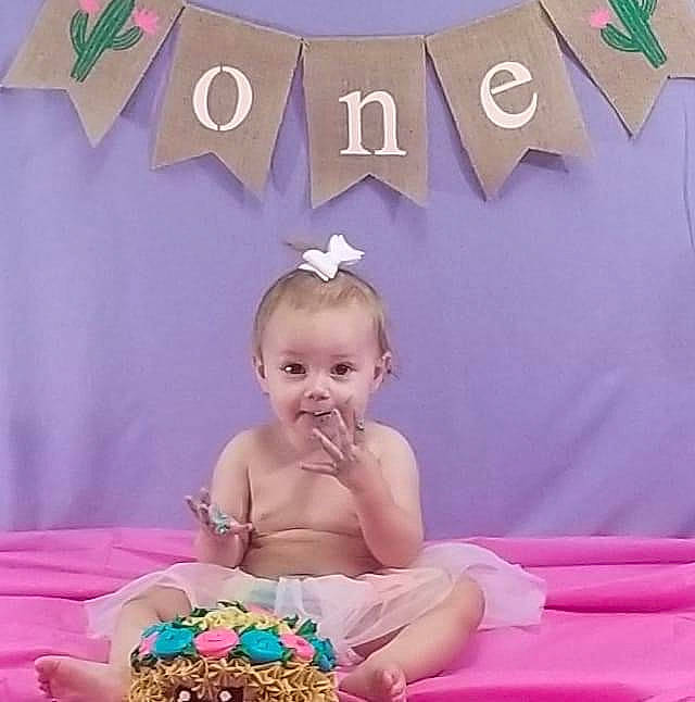 Wynonna is registered to the contest to win money with this photo: baby, baked_goods, birthday, birthday_cake, birthday_party, buttercream, cake, cake_decorating, child, dessert, event, food, icing, party, person, pink, sweetness, toddler