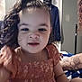 Azalea joined the competition — help win amazing prizes! toddler, child, curly_hair, orange_dress, indoor, tattoo, person, smiling, face, hair_tied, door, clothing, portrait, baby, skin, human, cute, young_child, fashion, sitting